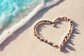 love heart drawn in sand on a beach